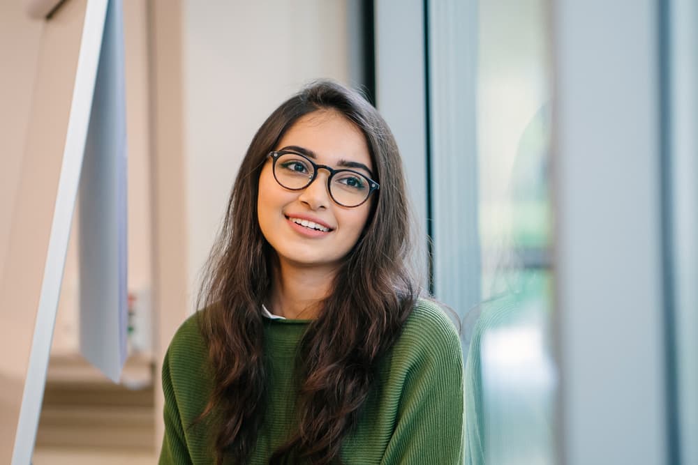 Headshot with classroom background