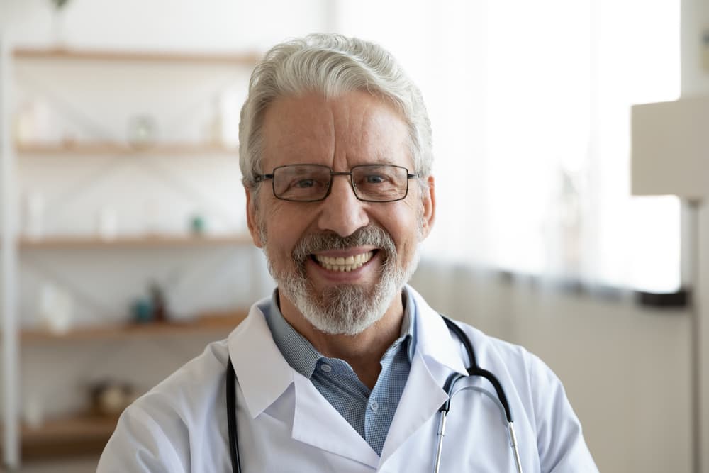 Headshot with hospital background